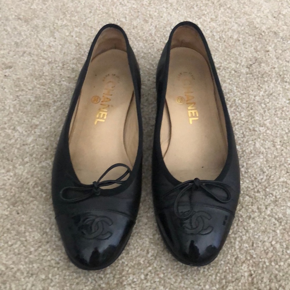 Black leather Chanel flats